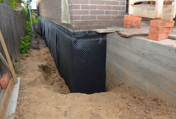 SJ Waterproofing Pros technician performing targeted Waterproofing assessment in Fortville, IN